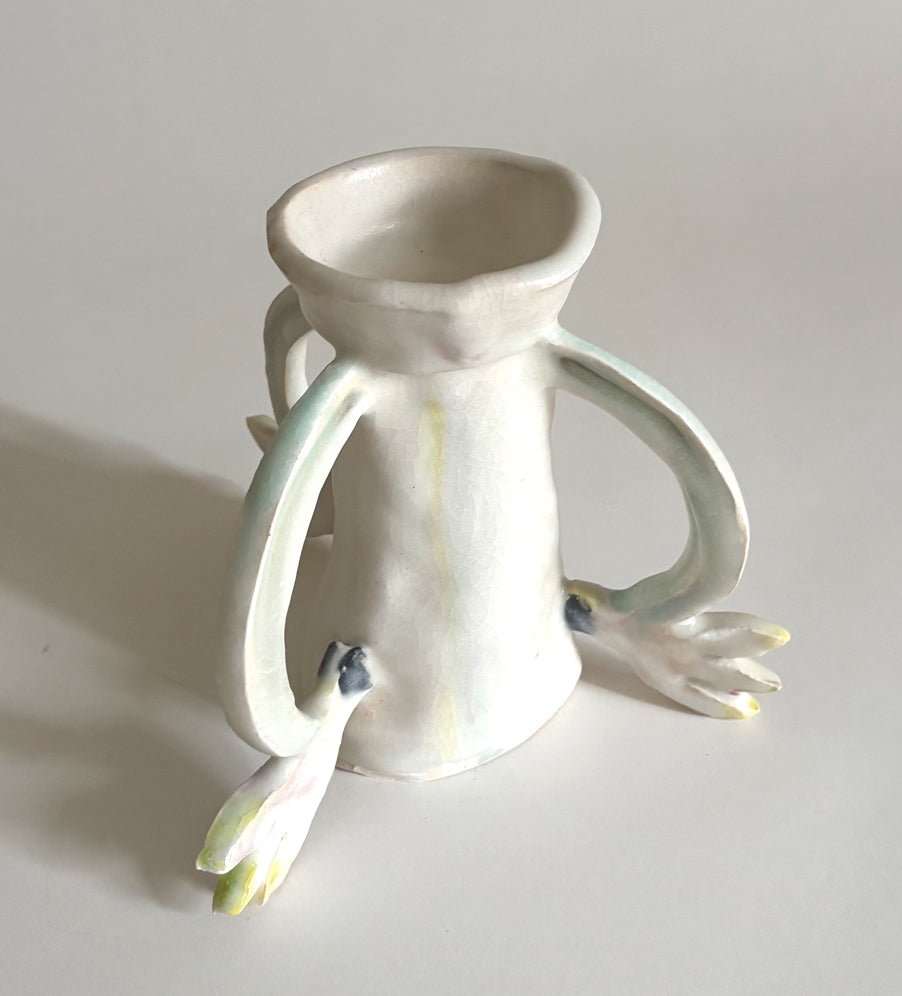Three Cyclamens holding a candle