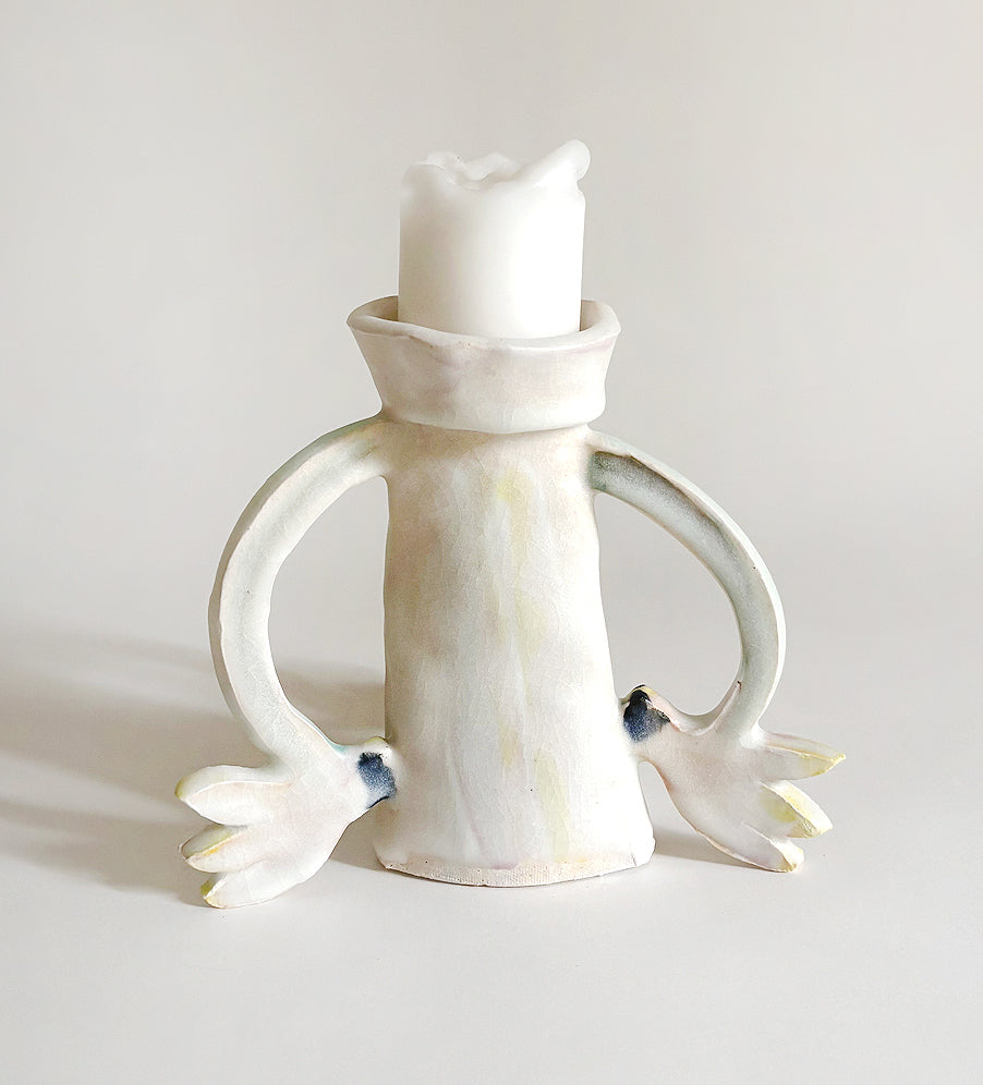 Three Cyclamens holding a candle