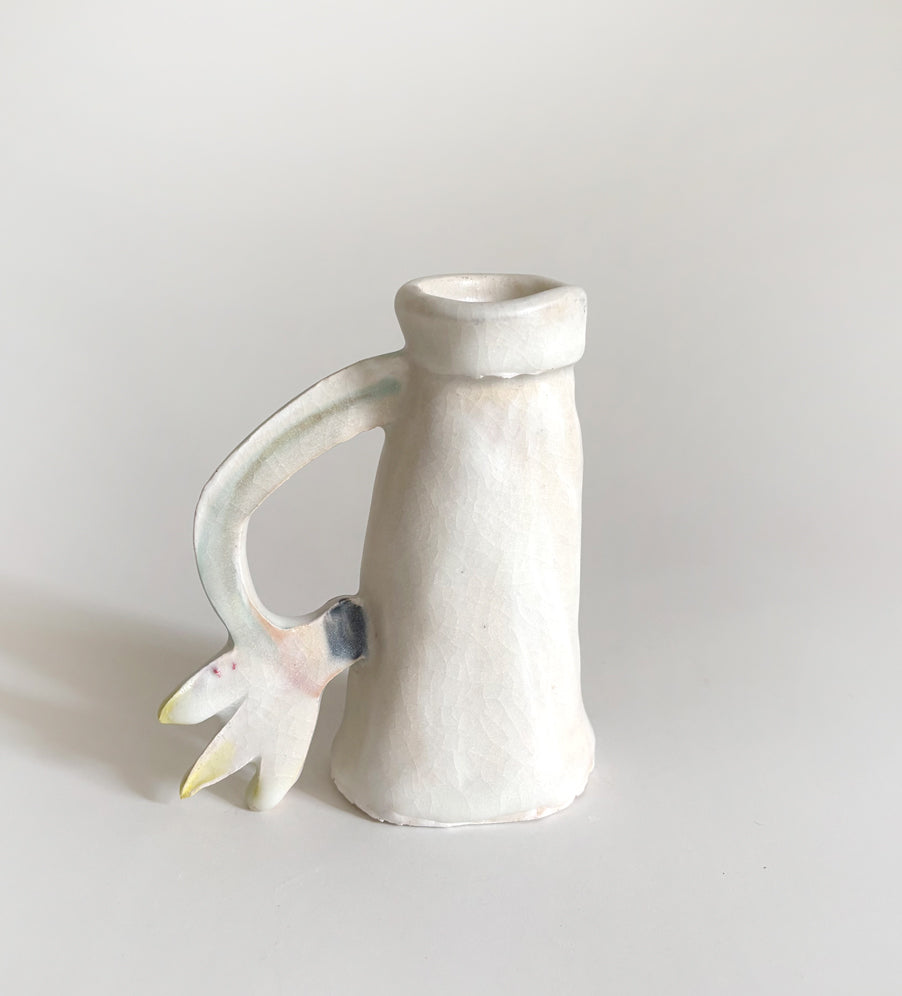 One Cyclamen holding a candle