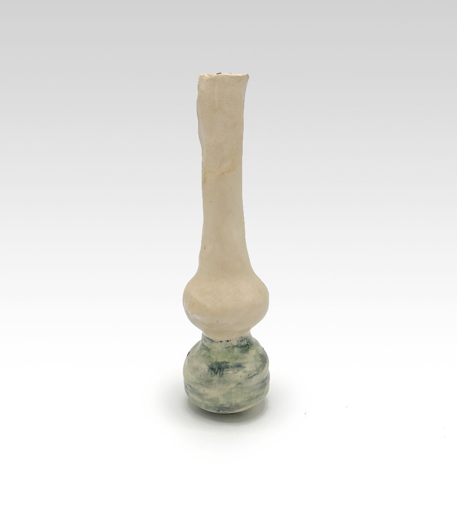 Thin vase with a Cyclamen flower