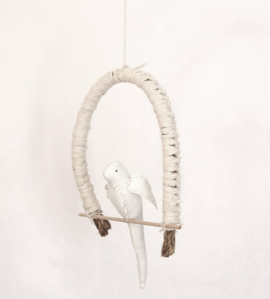 Bird on a perch. White bird
