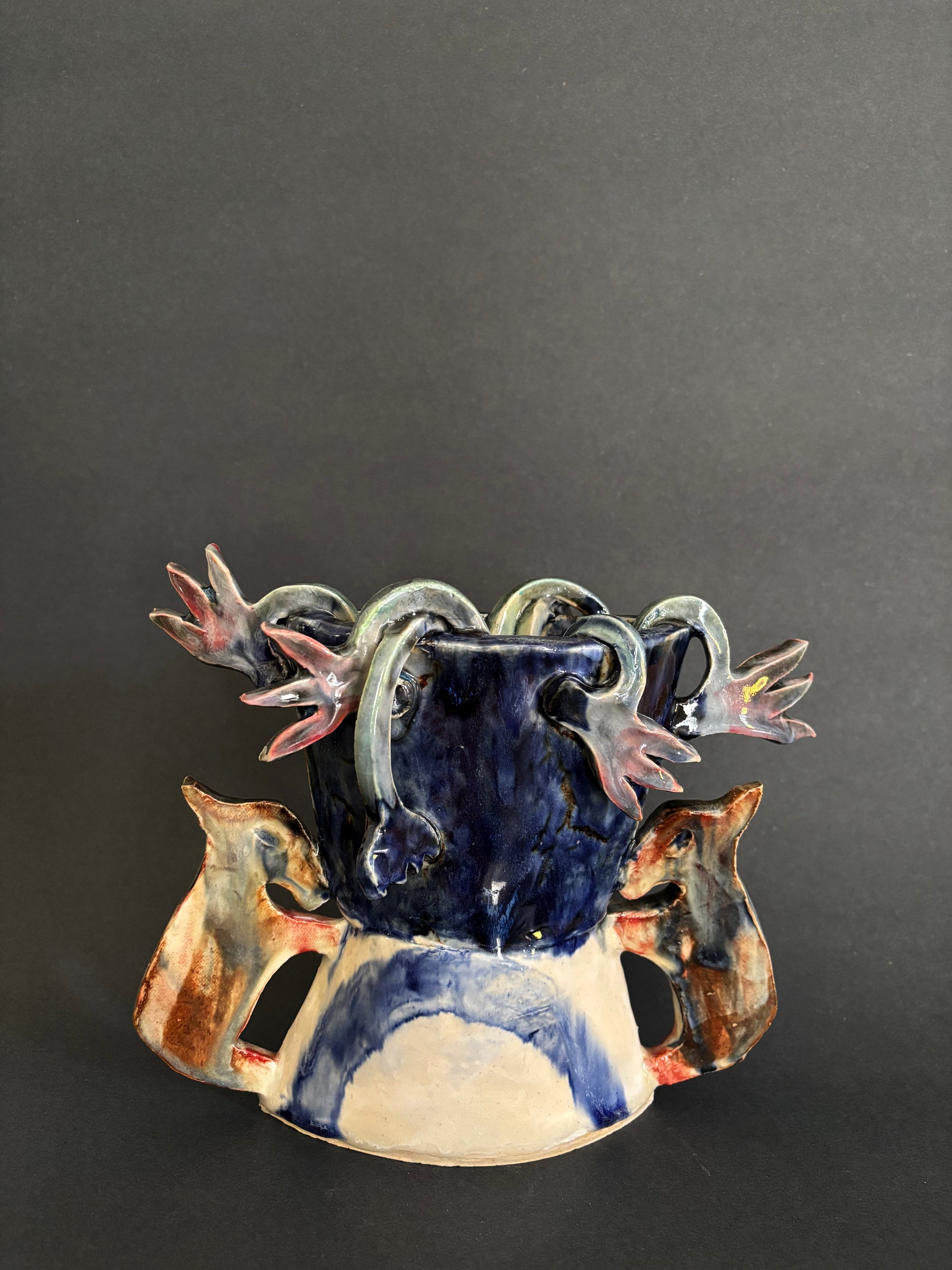 Two donkeys holding a vase with cyclamens - Vase