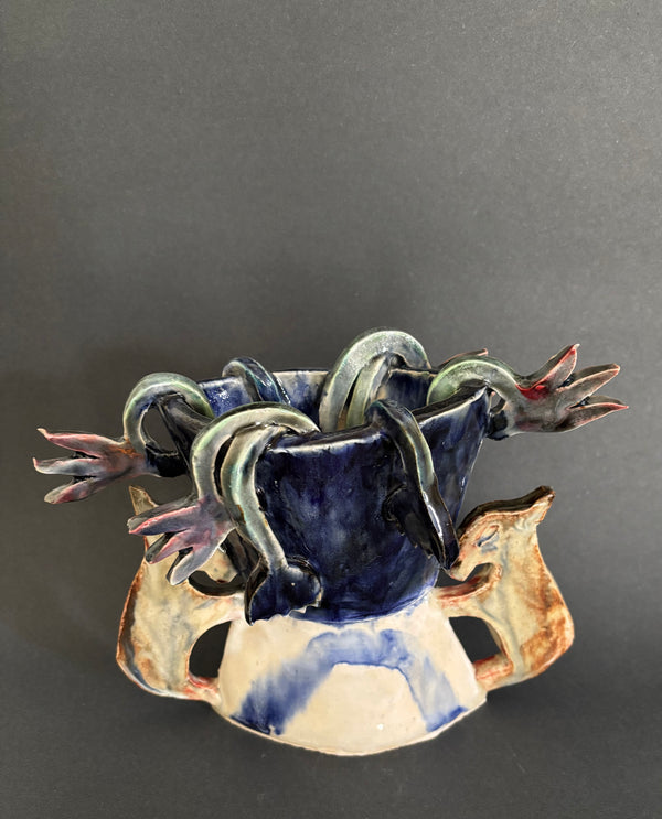 Two donkeys holding a vase with cyclamens - Vase