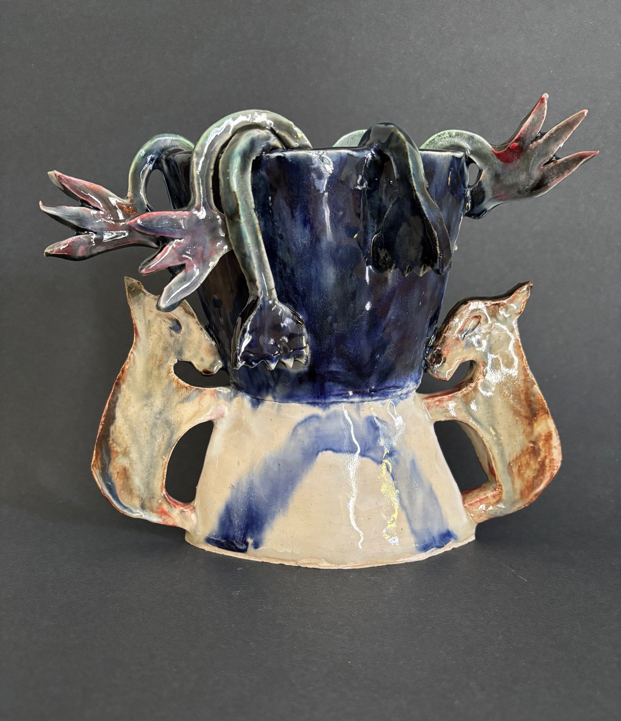 Two donkeys holding a vase with cyclamens - Vase