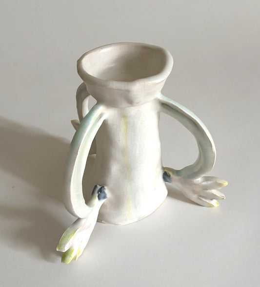 Three Cyclamens holding a candle