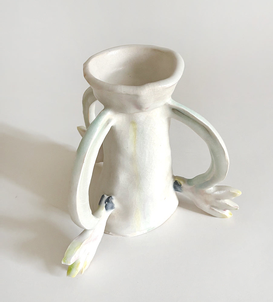 Three Cyclamens holding a candle