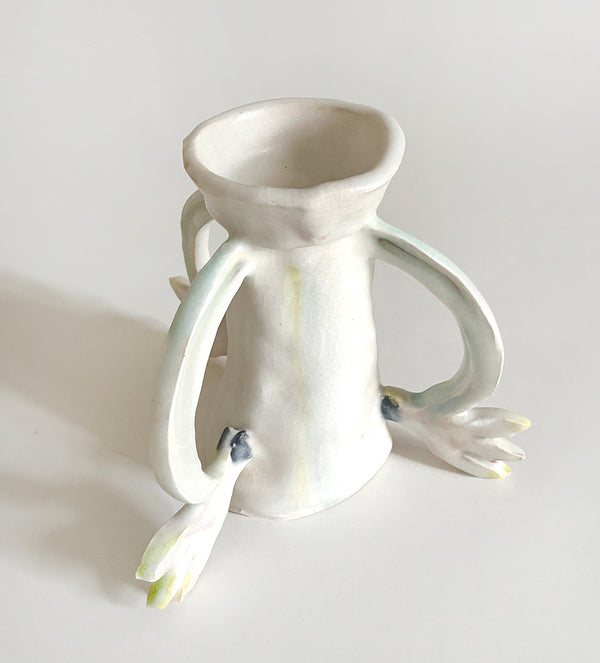Three Cyclamens holding a candle