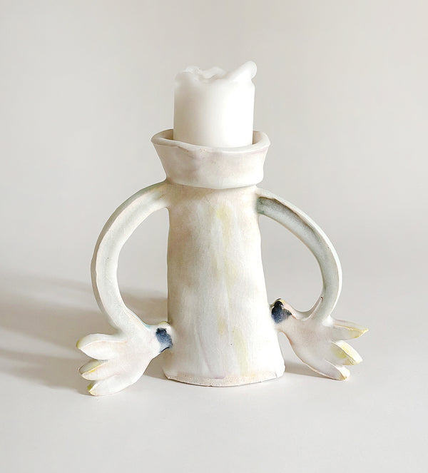 Three Cyclamens holding a candle