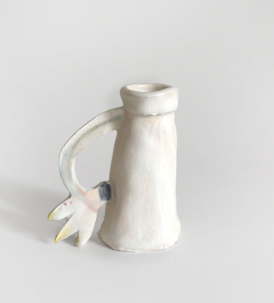 One Cyclamen holding a candle