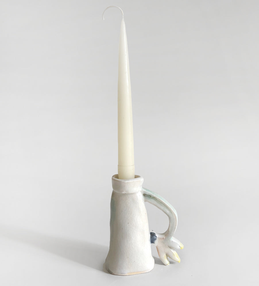 One Cyclamen holding a candle