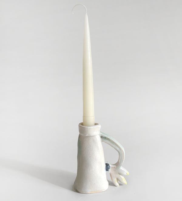One Cyclamen holding a candle