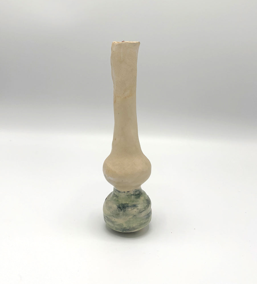 Thin vase with a Cyclamen flower