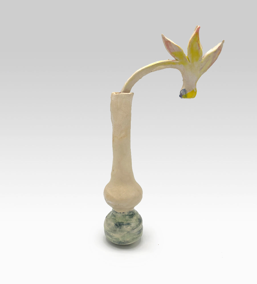 Thin vase with a Cyclamen flower